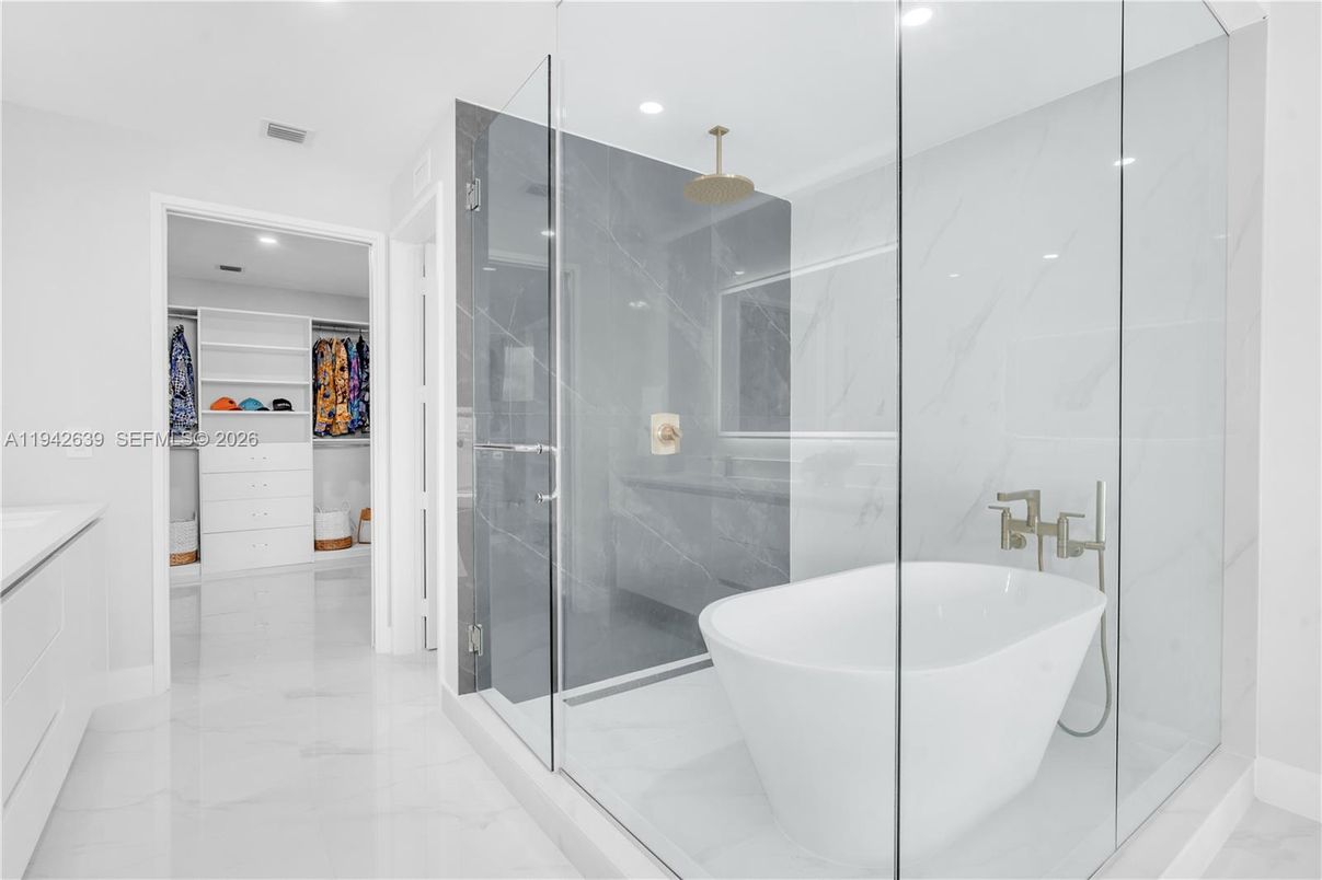 Bathroom, Free Standing Baths, Glass Shower, Interior, Marble, Marble Walls, Recessed Lighting
