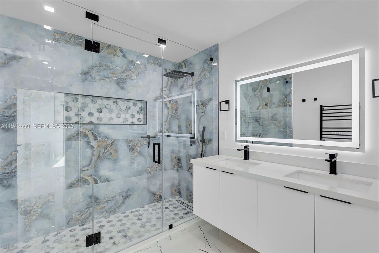 Bathroom, Dual Sink Vanities, Glass Shower, Interior, Marble, Marble Walls, Recessed Lighting