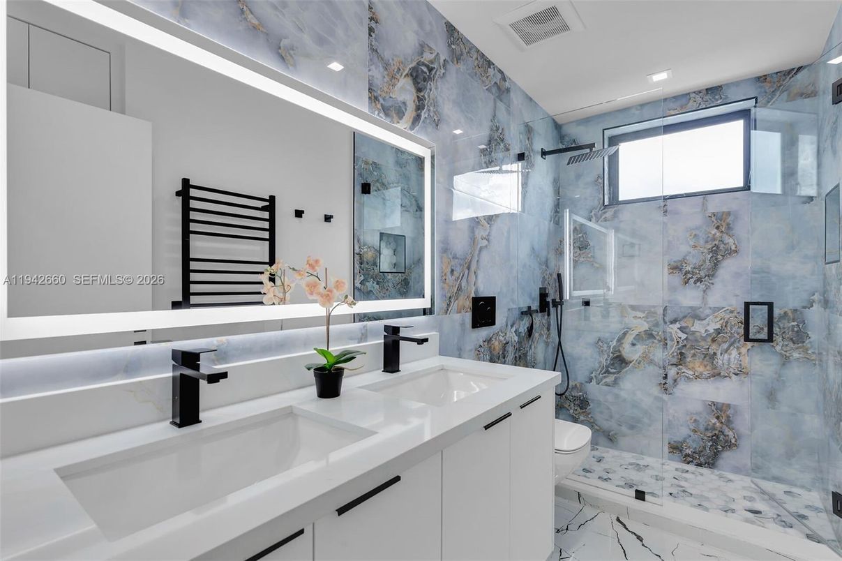 Bathroom, Dual Sink Vanities, Glass Shower, Interior, Marble, Marble Walls, Recessed Lighting