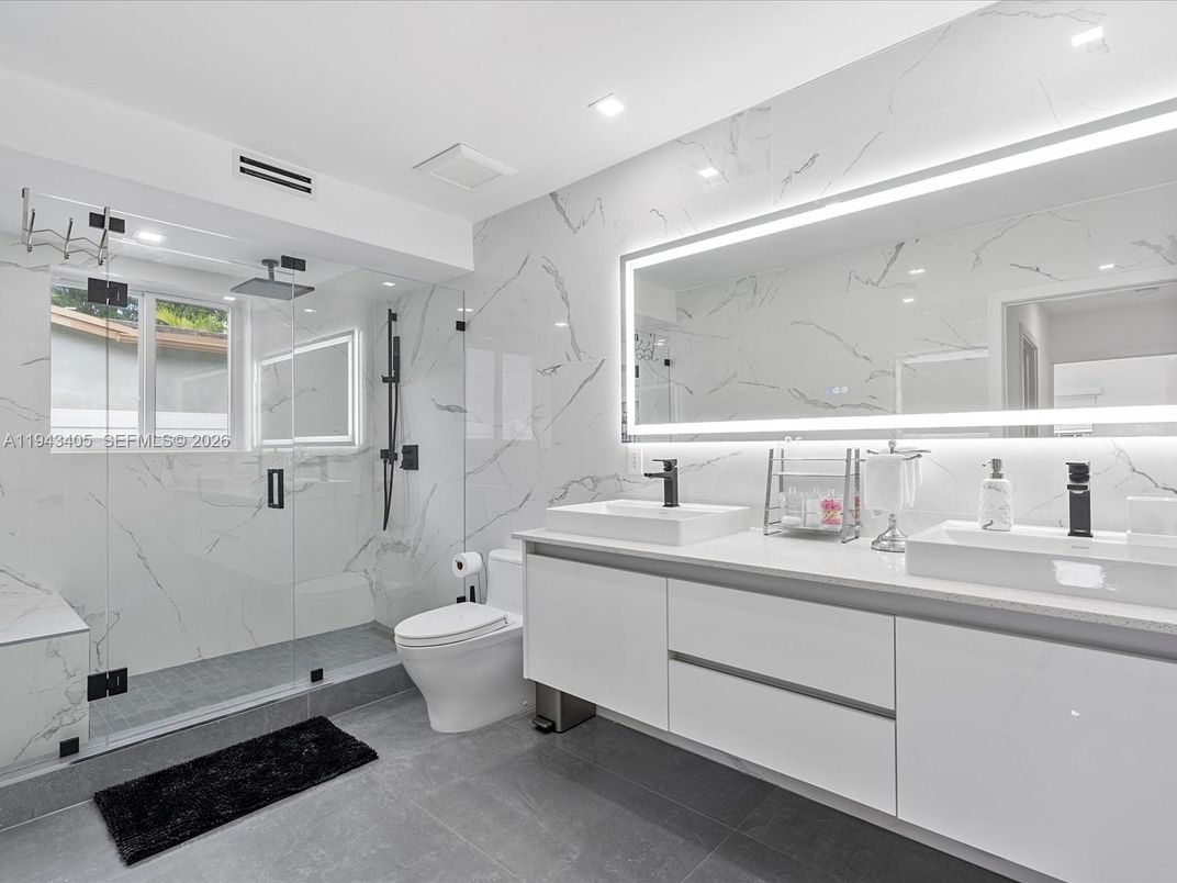 Bathroom, Dual Sink Vanities, Glass Shower, Interior, Marble Walls, Recessed Lighting