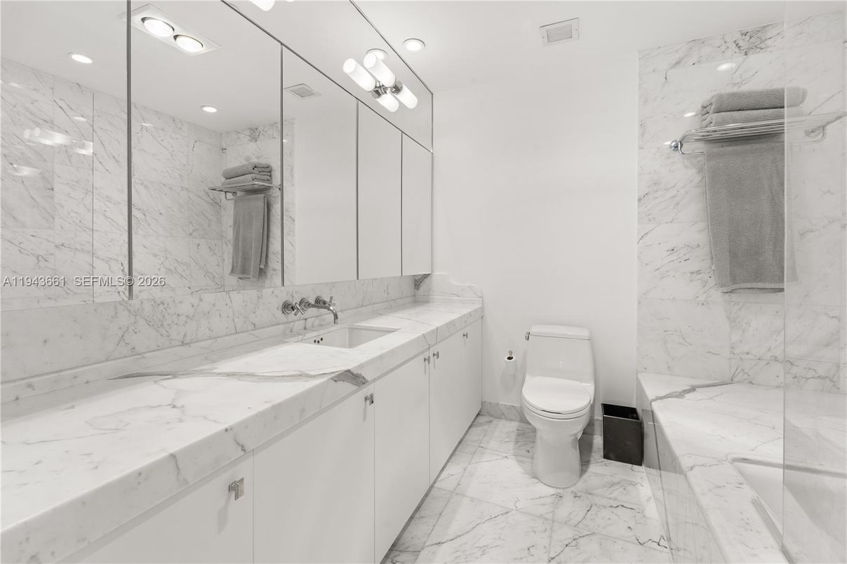 Bathroom, Dual Sink Vanities, Glass Shower, Interior, Marble, Marble Walls, Recessed Lighting