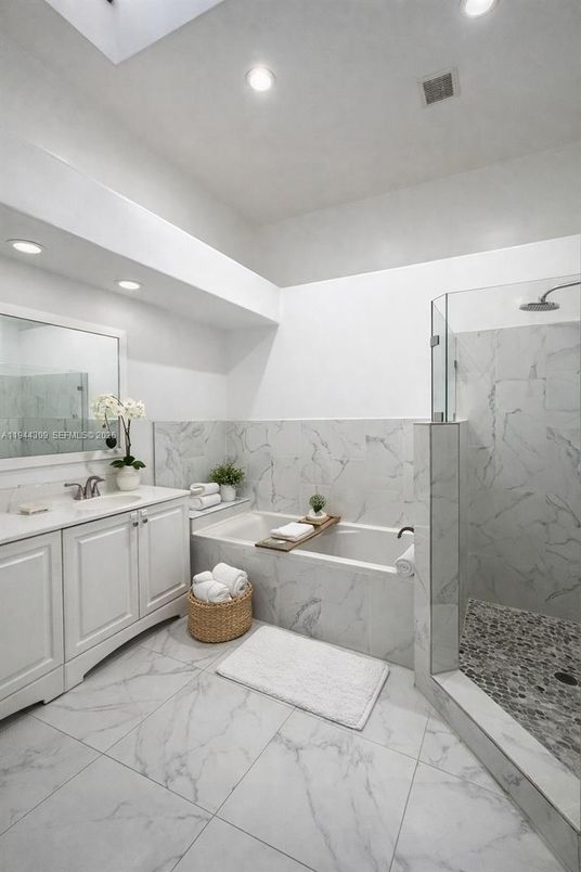 Bathroom, Dual Sink Vanities, Glass Shower, Interior, Marble, Marble Walls, Recessed Lighting
