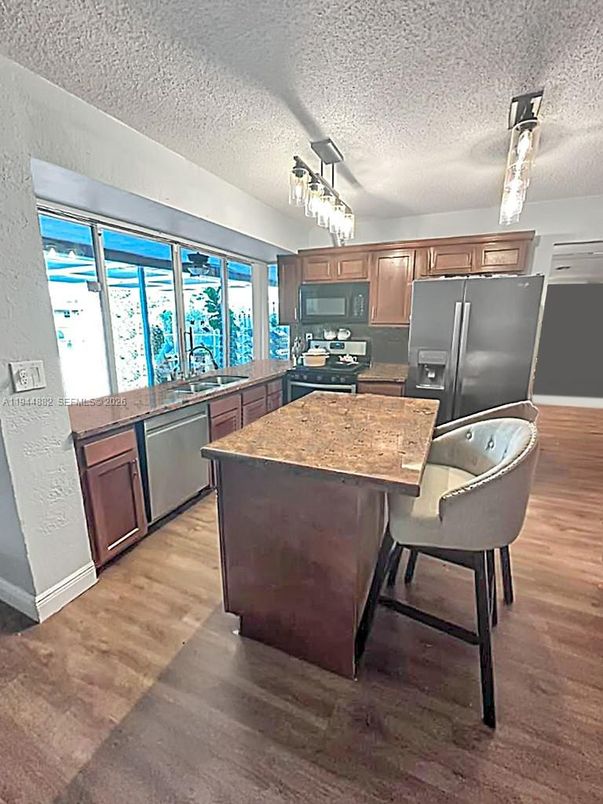 Chandelier, Dining room, Interior, Kitchen, Stainless Steel Appliances, Wood Texture Flooring