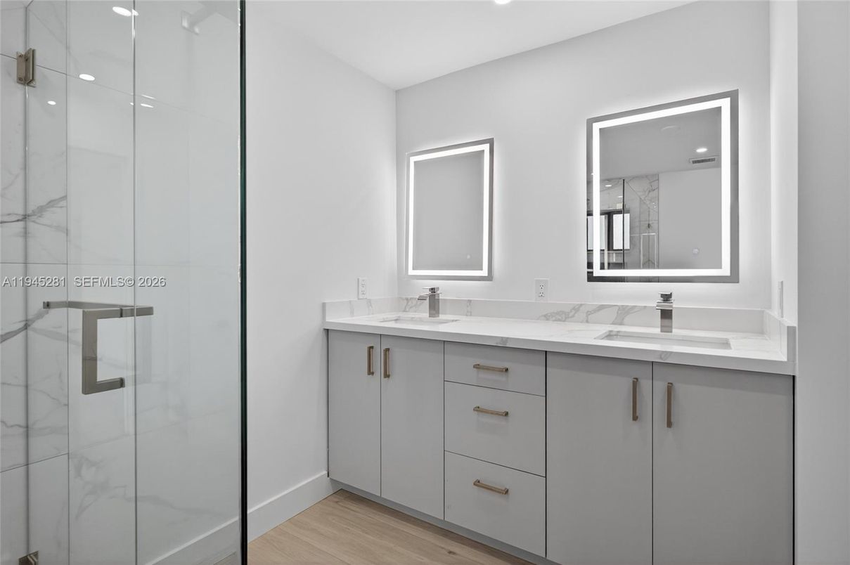 Bathroom, Dual Sink Vanities, Glass Shower, Interior, Recessed Lighting, Wood Texture Flooring