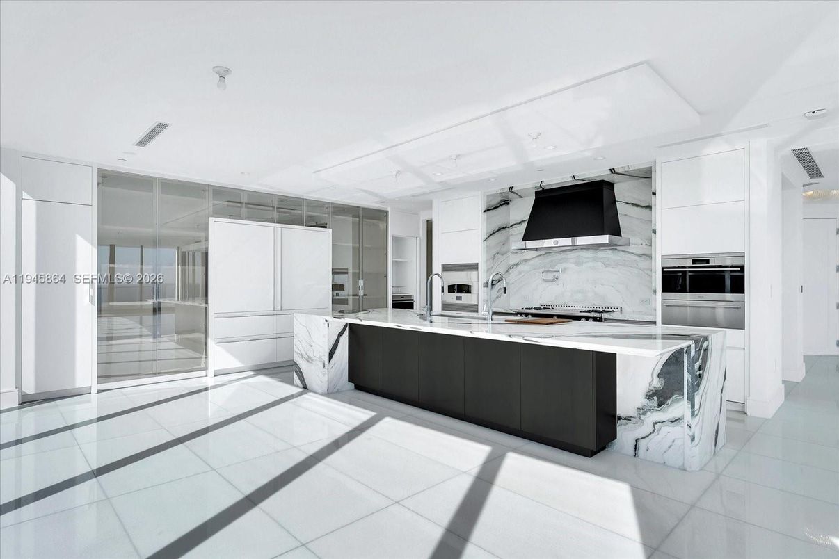 Interior, Kitchen, Marble Walls, Recessed Lighting, Stainless Steel Appliances