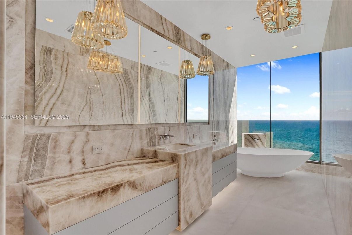 Bathroom, Dual Sink Vanities, Free Standing Baths, Interior, Marble Walls, Recessed Lighting, Water