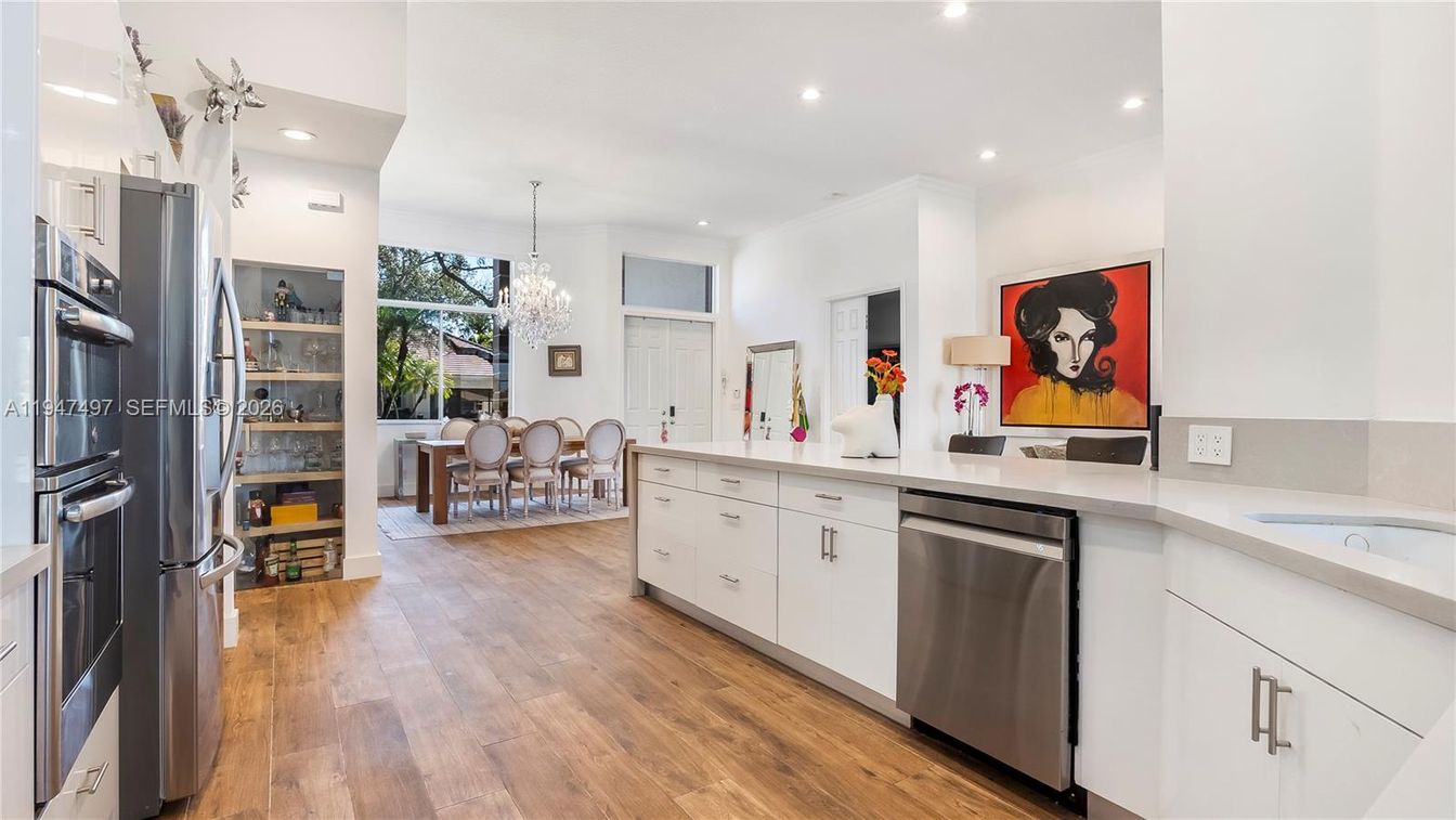 Chandelier, Dining room, Interior, Kitchen, Recessed Lighting, Stainless Steel Appliances, Wood Texture Flooring