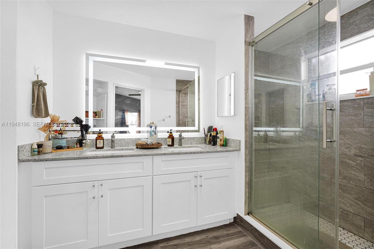 Bathroom, Dual Sink Vanities, Glass Shower, Interior, Wood Texture Flooring