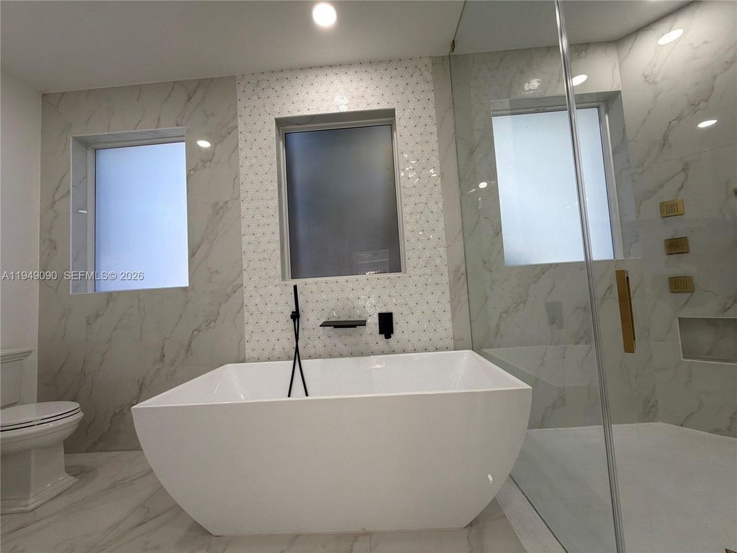 Bathroom, Free Standing Baths, Glass Shower, Interior, Marble, Marble Walls, Recessed Lighting