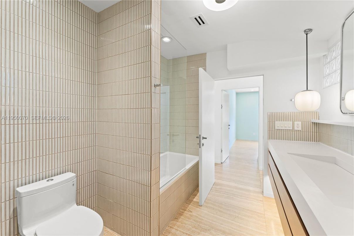 Bathroom, Dual Sink Vanities, Interior, Pendant Lights, Recessed Lighting, Wood Texture Flooring