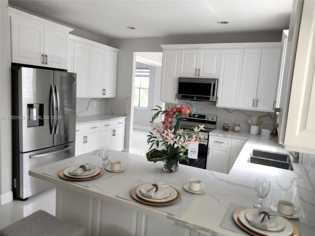 Interior, Kitchen, Marble Walls, Recessed Lighting, Stainless Steel Appliances