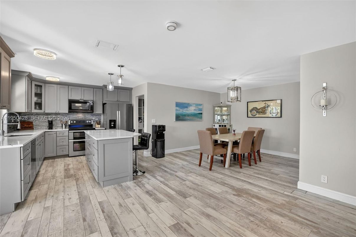 Dining room, Interior, Kitchen, Pendant Lights, Stainless Steel Appliances, Wood Texture Flooring