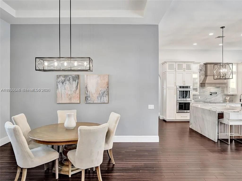 Dining room, Interior, Kitchen, Pendant Lights, Recessed Lighting, Stainless Steel Appliances, Wood Texture Flooring