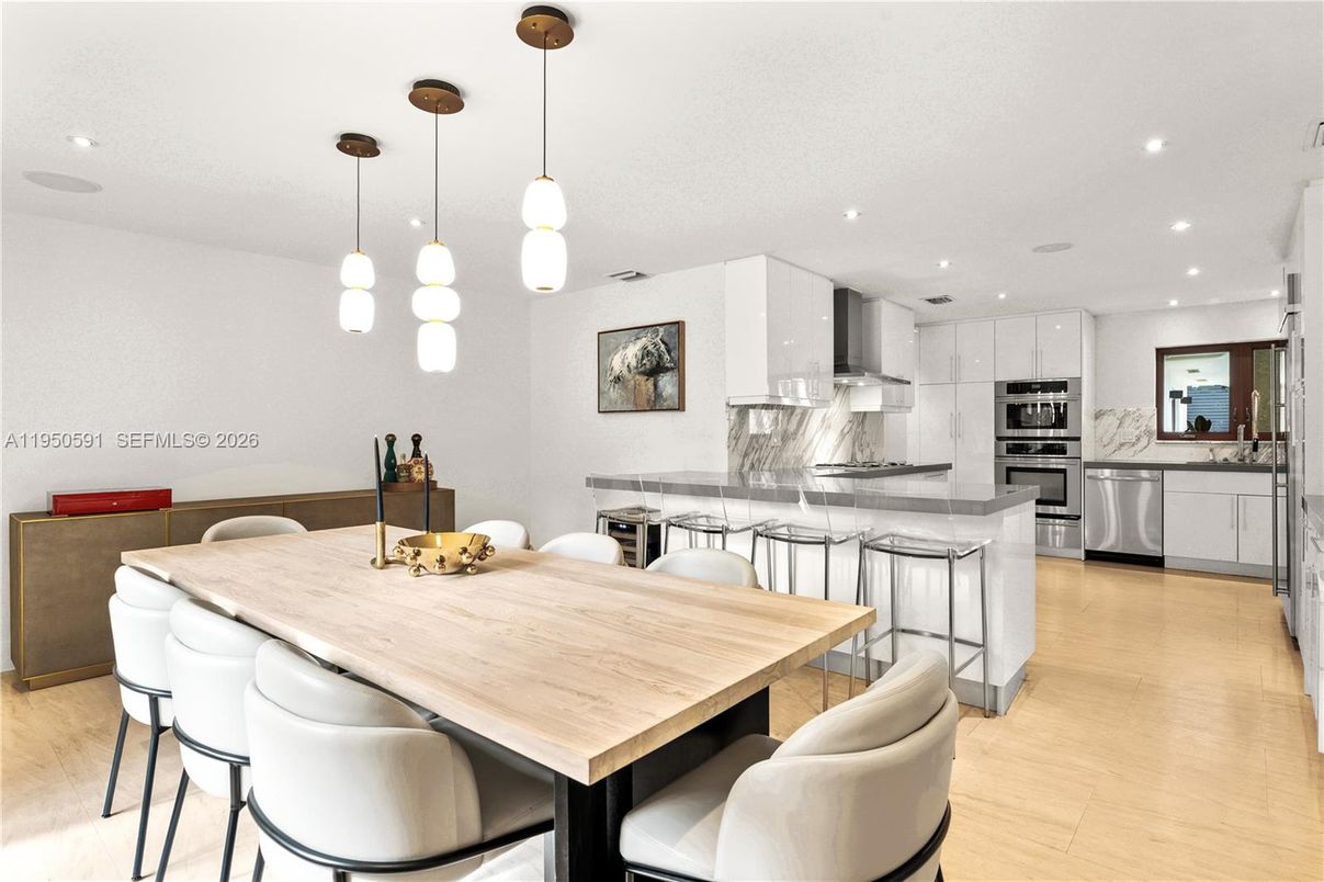 Dining room, Interior, Kitchen, Pendant Lights, Recessed Lighting, Stainless Steel Appliances, Wood Texture Flooring