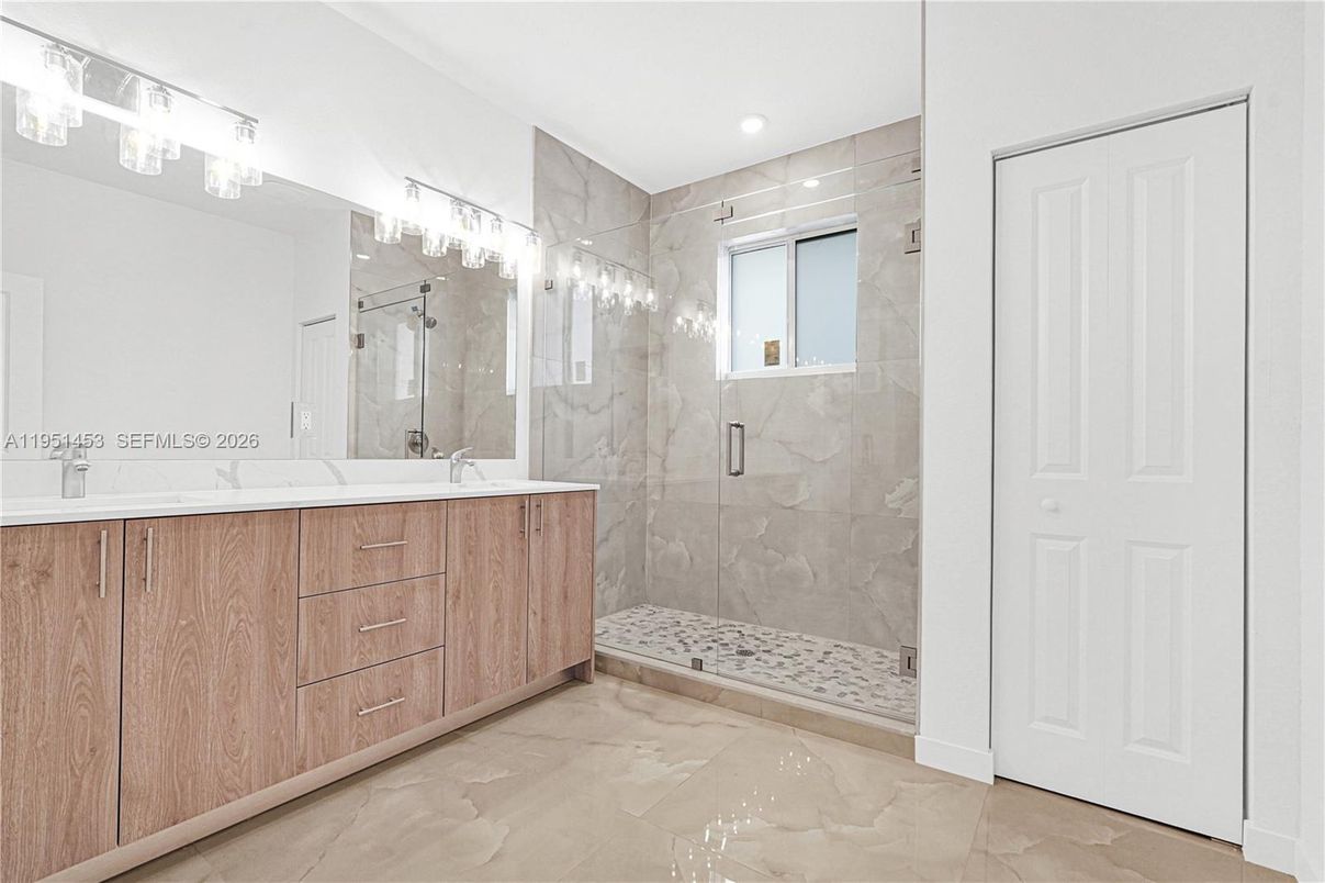 Bathroom, Dual Sink Vanities, Glass Shower, Interior, Marble Walls, Recessed Lighting