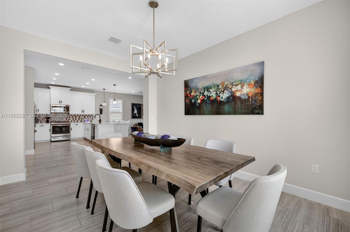 Dining room, Interior, Kitchen, Pendant Lights, Recessed Lighting, Stainless Steel Appliances, Wood Texture Flooring
