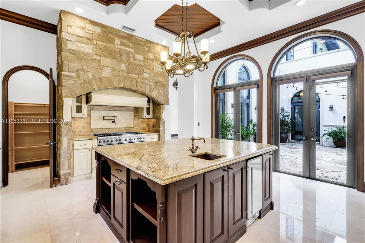 Chandelier, Interior, Kitchen, Pendant Lights, Recessed Lighting, Stainless Steel Appliances, Stone Walls