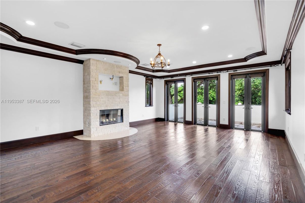 Chandelier, Empty room, Fireplace, Interior, Recessed Lighting, Wood Texture Flooring