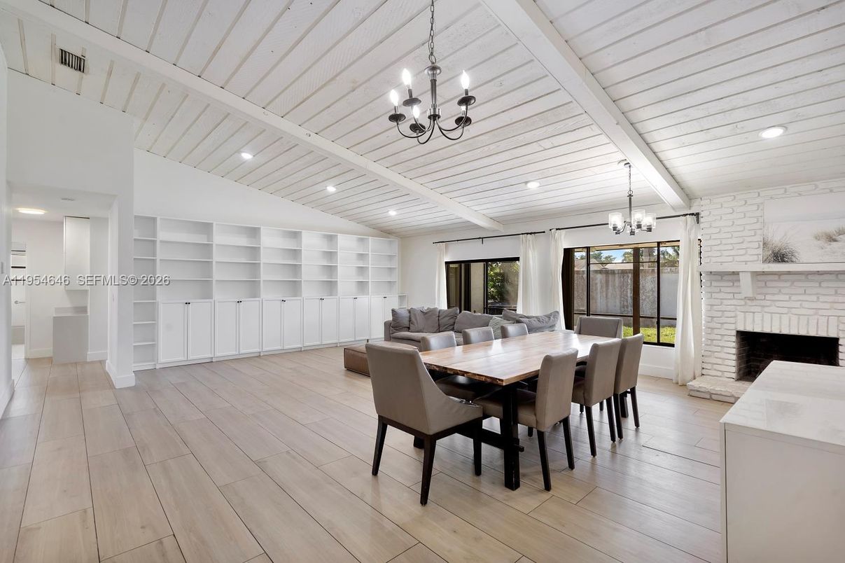 Chandelier, Dining room, Fireplace, Interior, Recessed Lighting, Stone Walls, Wood Texture Flooring