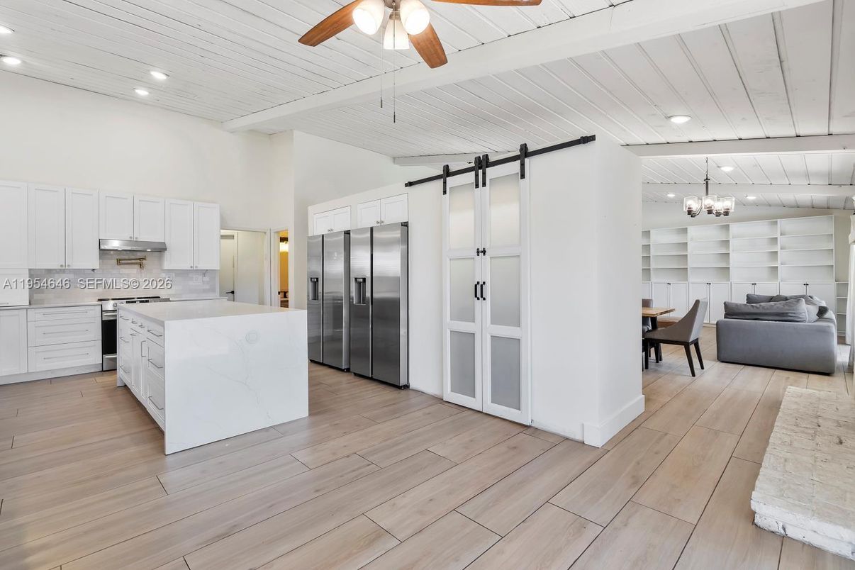 Chandelier, Dining room, Interior, Kitchen, Living room, Recessed Lighting, Stainless Steel Appliances, Wood Texture Flooring