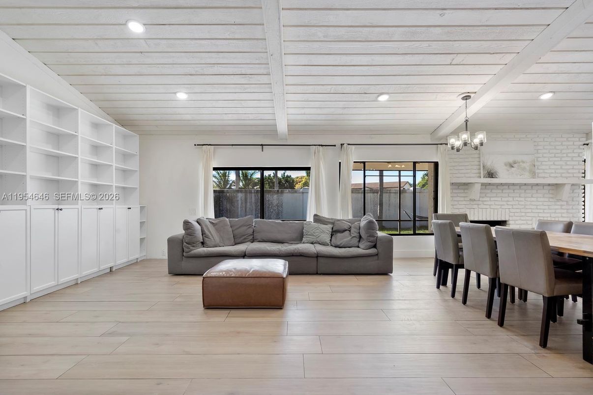 Chandelier, Dining room, Interior, Living room, Recessed Lighting, Stone Walls, Wood Texture Flooring