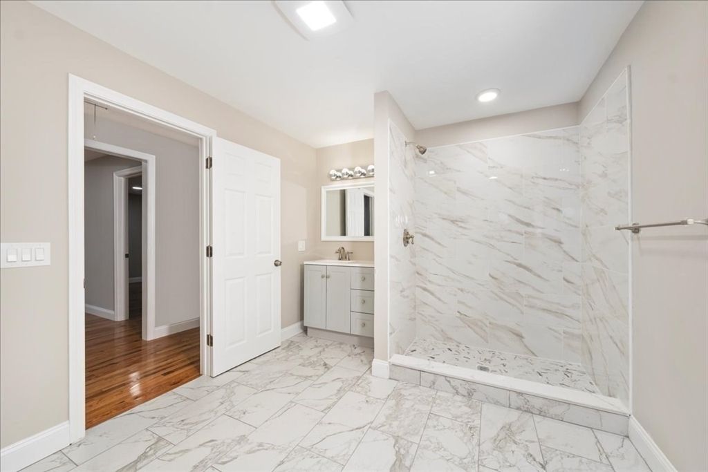 Bathroom, Glass Shower, Interior, Marble, Marble Walls, Recessed Lighting, Wood Texture Flooring