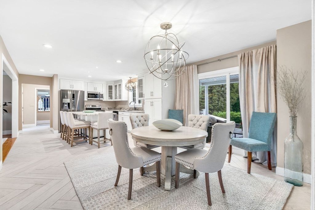 Chandelier, Dining room, Interior, Kitchen, Pendant Lights, Recessed Lighting, Stainless Steel Appliances, Wood Texture Flooring