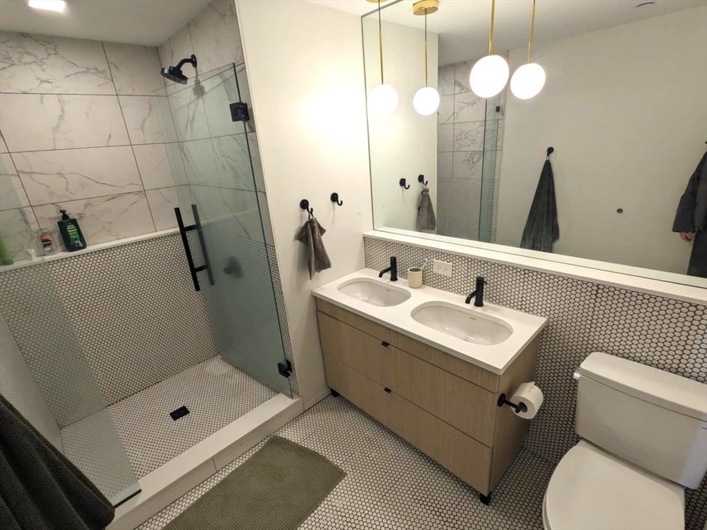 Bathroom, Dual Sink Vanities, Glass Shower, Interior, Marble Walls, Pendant Lights