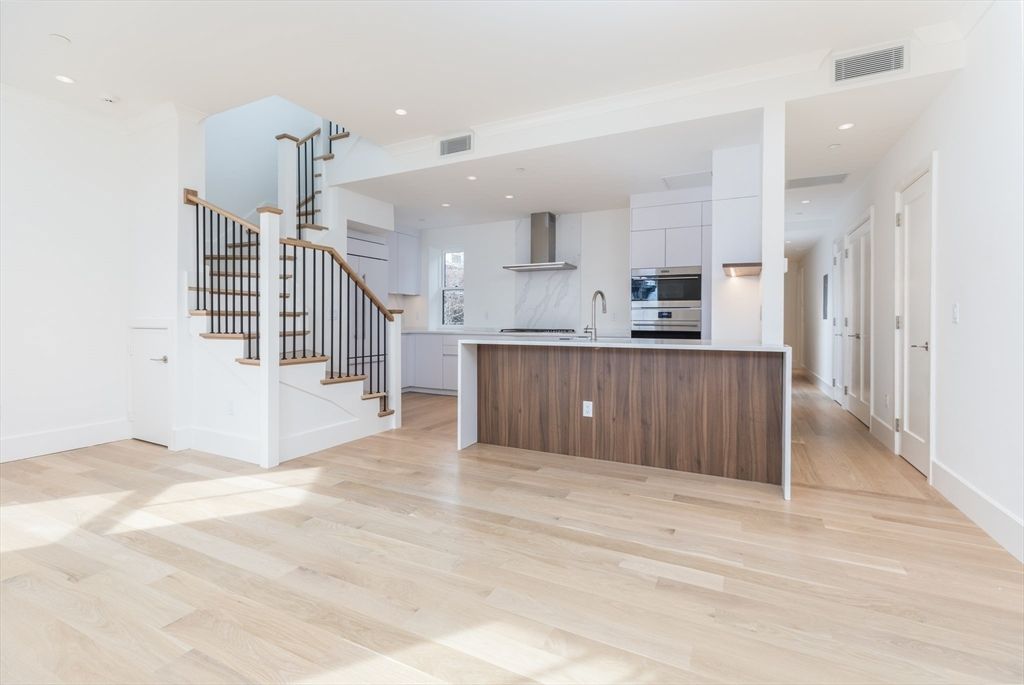 Interior, Kitchen, Marble Walls, Recessed Lighting, Stainless Steel Appliances, Wood Texture Flooring