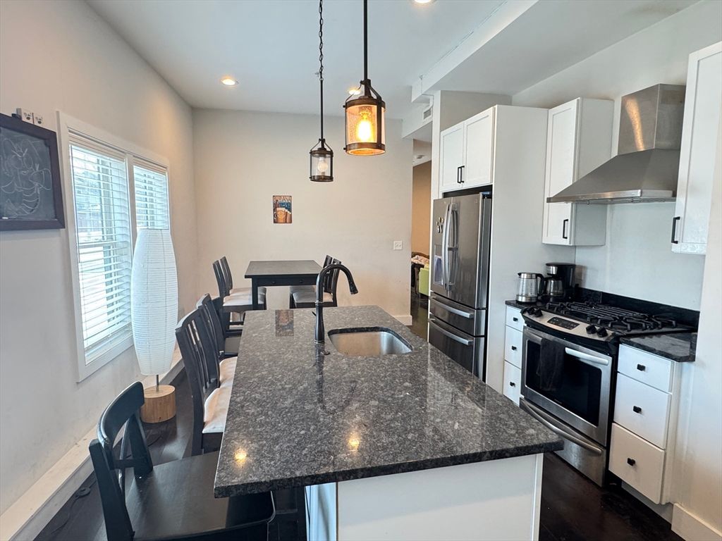 Dining room, Interior, Kitchen, Pendant Lights, Recessed Lighting, Stainless Steel Appliances, Wood Texture Flooring