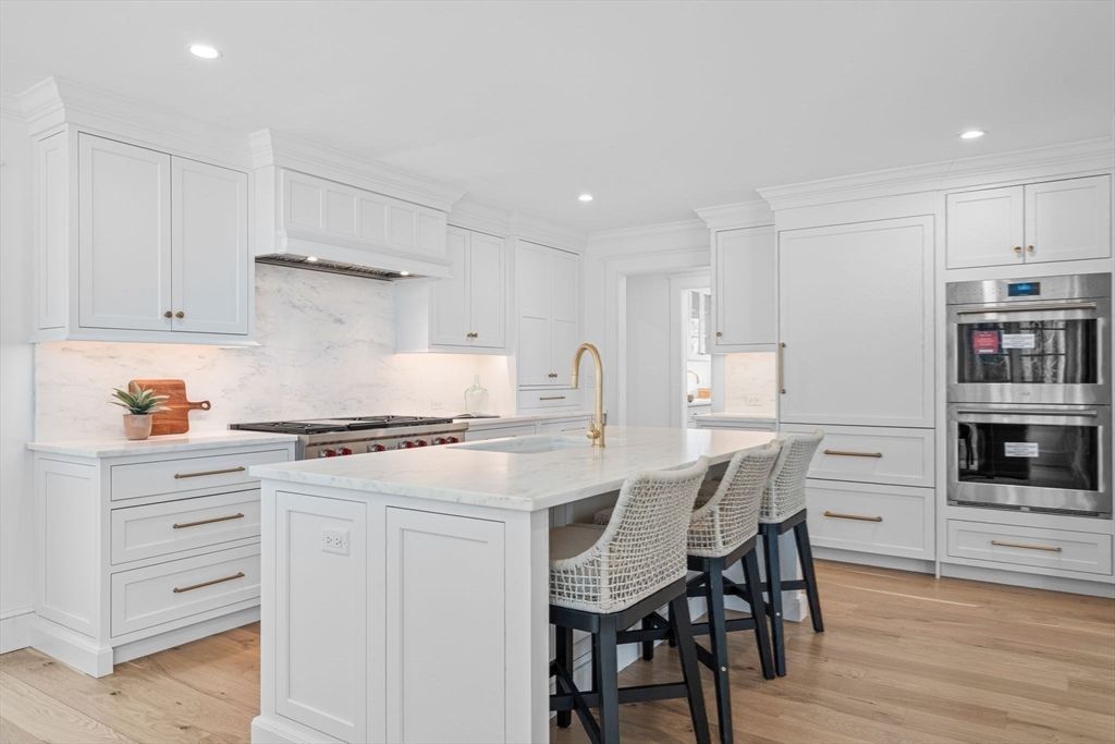 Interior, Kitchen, Marble Walls, Recessed Lighting, Stainless Steel Appliances, Wood Texture Flooring