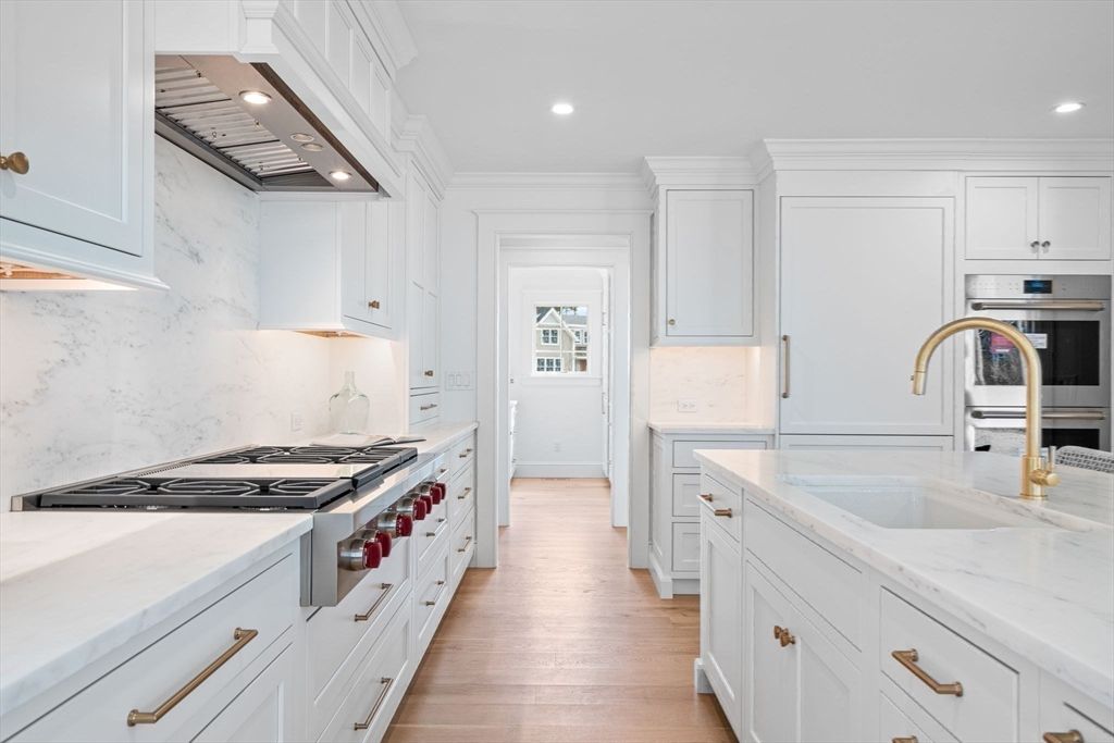 Interior, Kitchen, Marble Walls, Recessed Lighting, Stainless Steel Appliances, Wood Texture Flooring