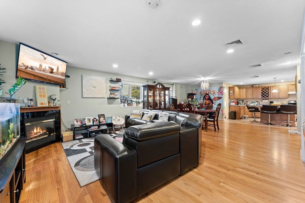Dining room, Fireplace, Interior, Living room, Pendant Lights, Recessed Lighting, Wood Texture Flooring