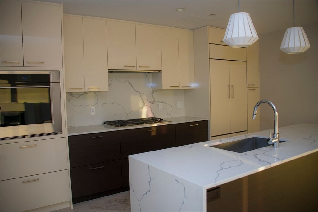 Interior, Kitchen, Marble Walls, Pendant Lights, Recessed Lighting, Stainless Steel Appliances