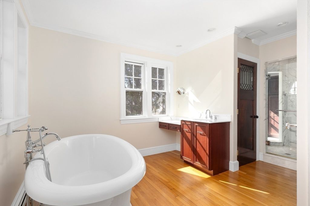 Bathroom, Free Standing Baths, Interior, Marble Walls, Recessed Lighting, Wood Texture Flooring