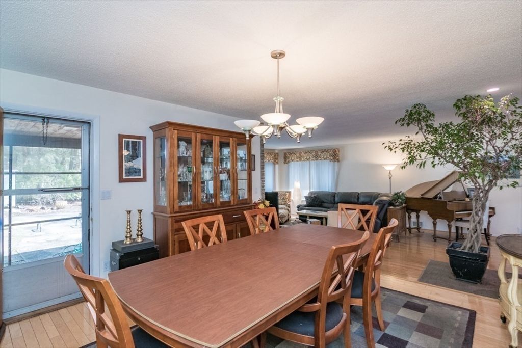 Chandelier, Dining room, Interior, Living room, Piano, Recessed Lighting, Wood Texture Flooring