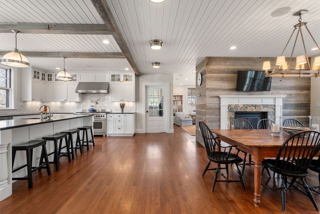 Dining room, Fireplace, Interior, Kitchen, Pendant Lights, Recessed Lighting, Stainless Steel Appliances, Wood Texture Flooring