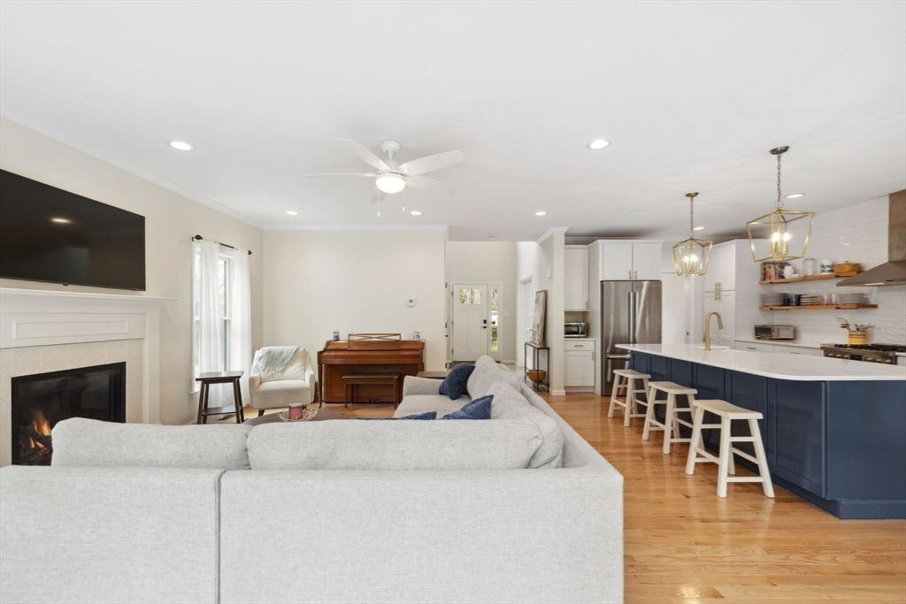 Fireplace, Interior, Kitchen, Living room, Pendant Lights, Piano, Recessed Lighting, Stainless Steel Appliances, Wood Texture Flooring