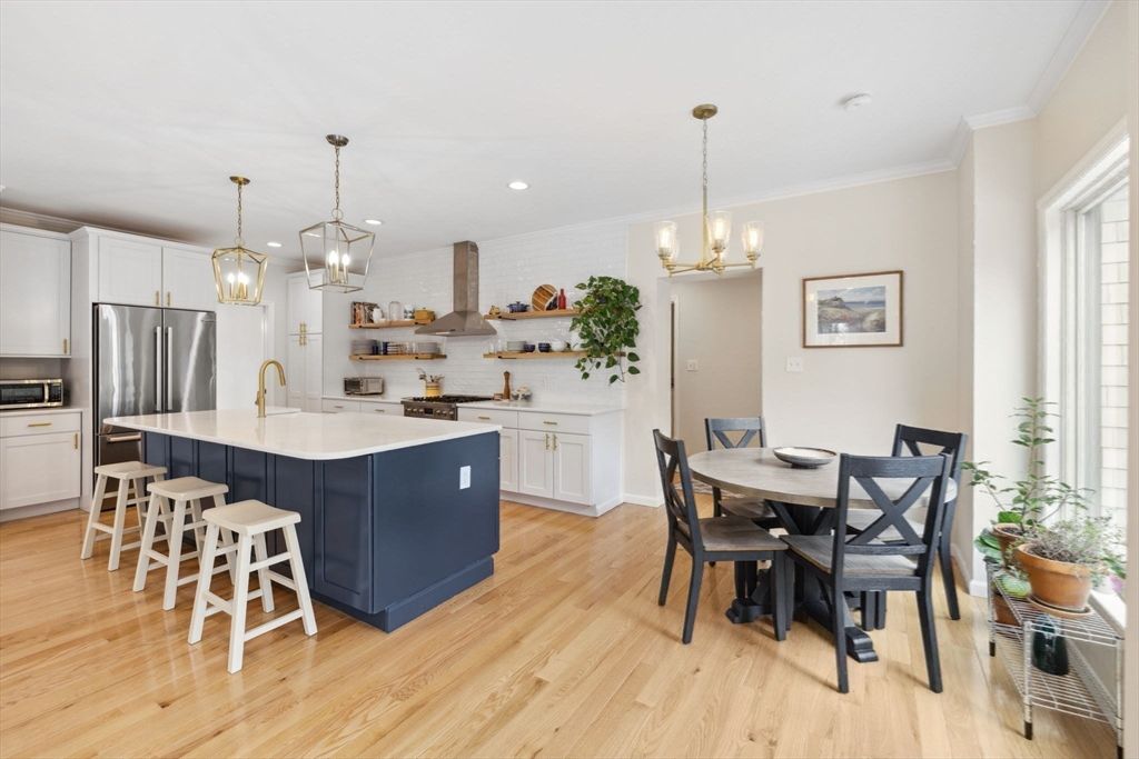 Dining room, Interior, Kitchen, Pendant Lights, Recessed Lighting, Stainless Steel Appliances, Wood Texture Flooring