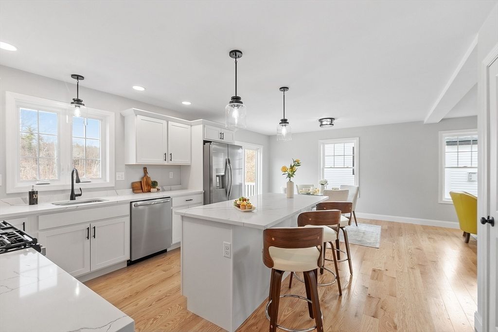 Dining room, Interior, Kitchen, Pendant Lights, Recessed Lighting, Stainless Steel Appliances, Wood Texture Flooring