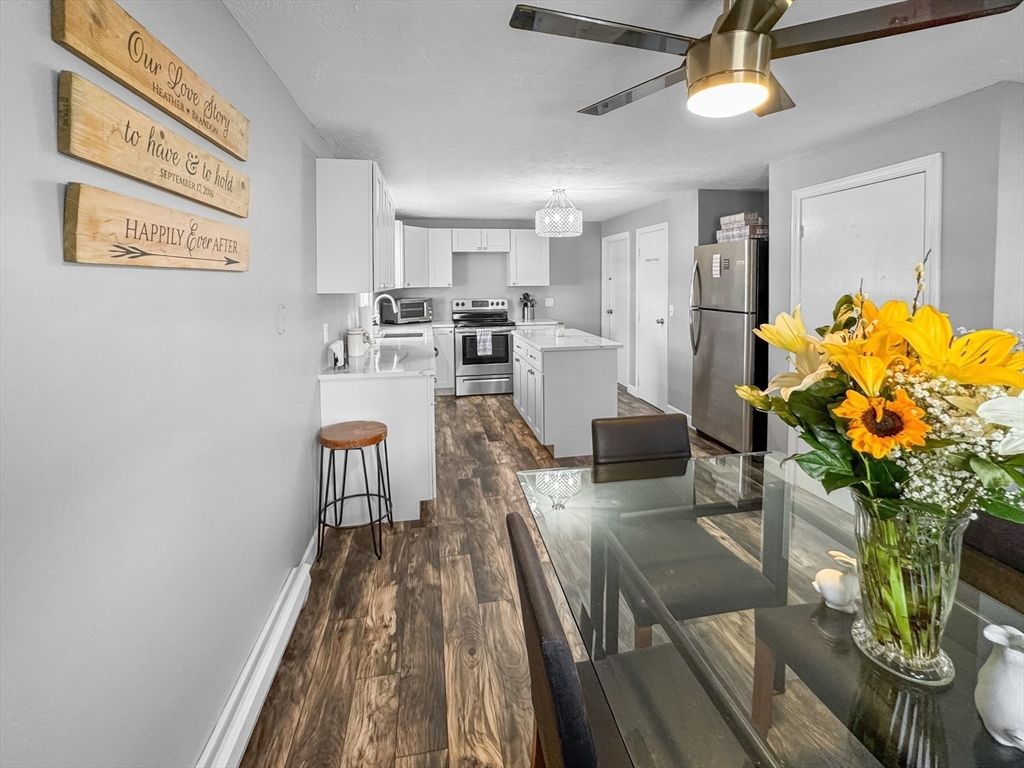 Chandelier, Dining room, Interior, Kitchen, Stainless Steel Appliances, Wood Texture Flooring