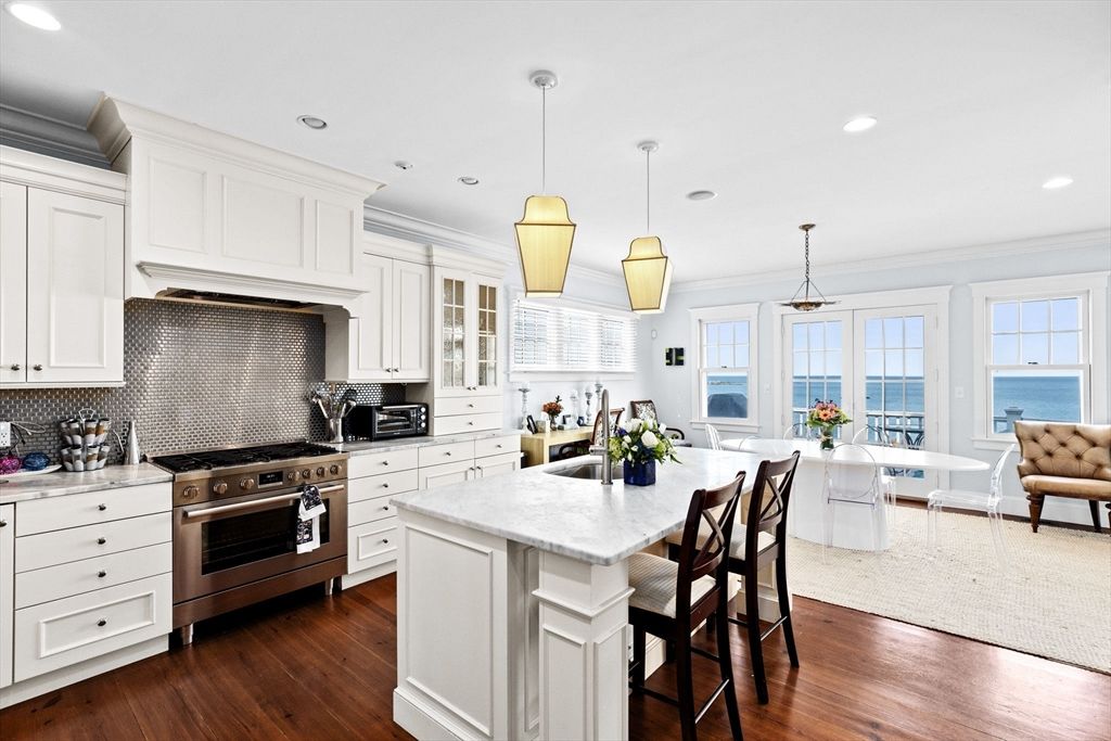 Dining room, Interior, Kitchen, Living room, Pendant Lights, Recessed Lighting, Stainless Steel Appliances, Water, Wood Texture Flooring