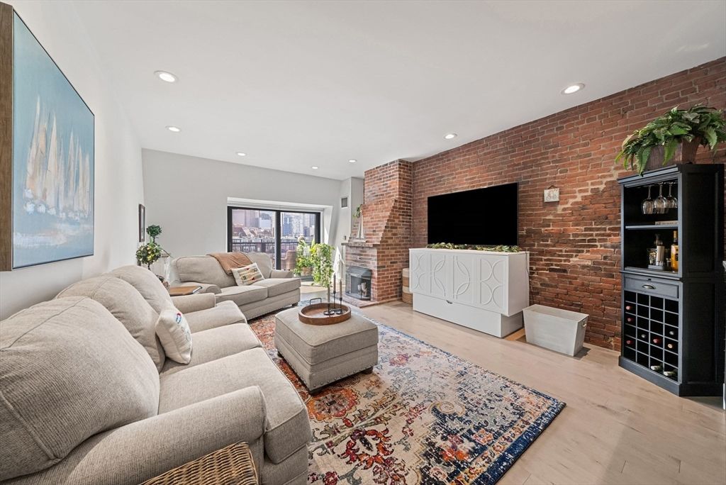 Fireplace, Interior, Living room, Recessed Lighting, Stone Walls, Wood Texture Flooring