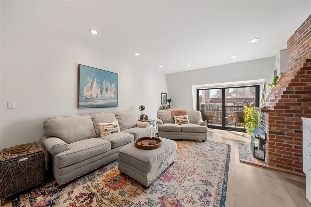 Fireplace, Interior, Living room, Recessed Lighting, Stone Walls, Wood Texture Flooring