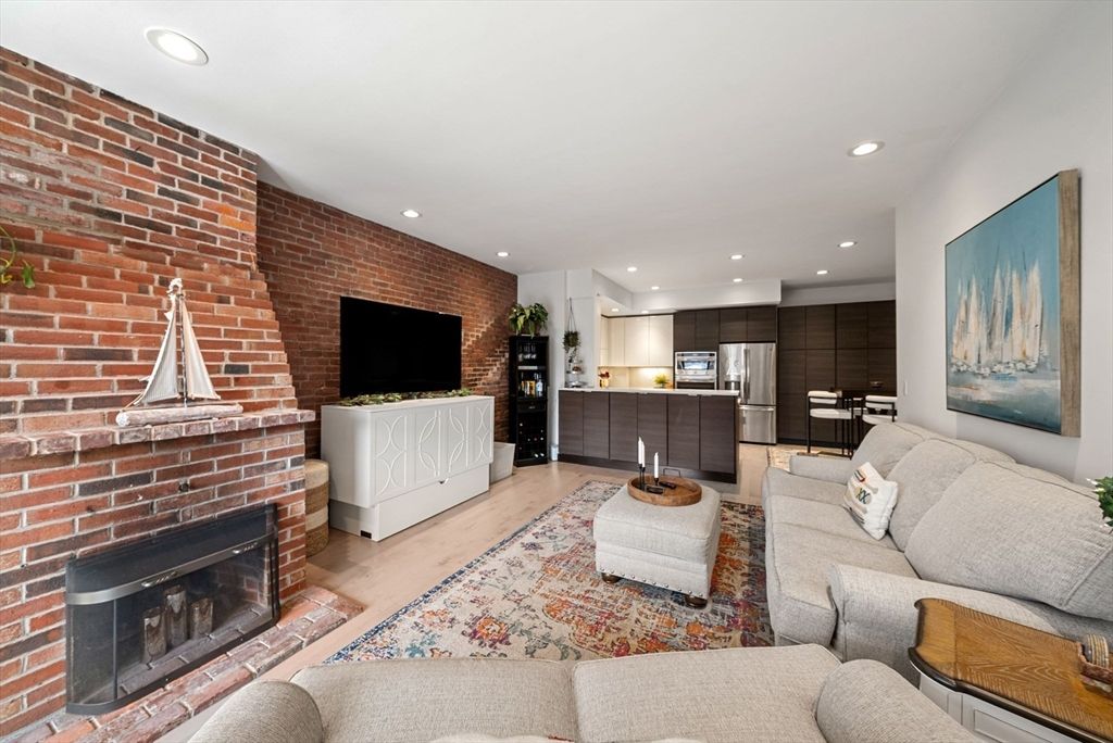 Fireplace, Interior, Kitchen, Living room, Recessed Lighting, Stainless Steel Appliances, Stone Walls, Wood Texture Flooring