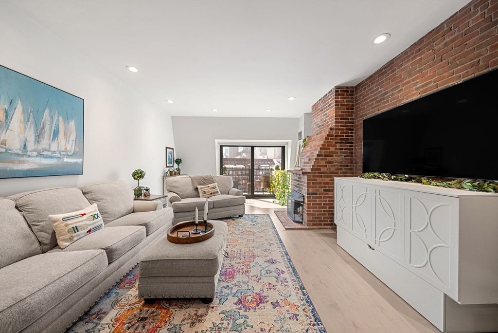 Fireplace, Interior, Living room, Recessed Lighting, Stone Walls, Wood Texture Flooring