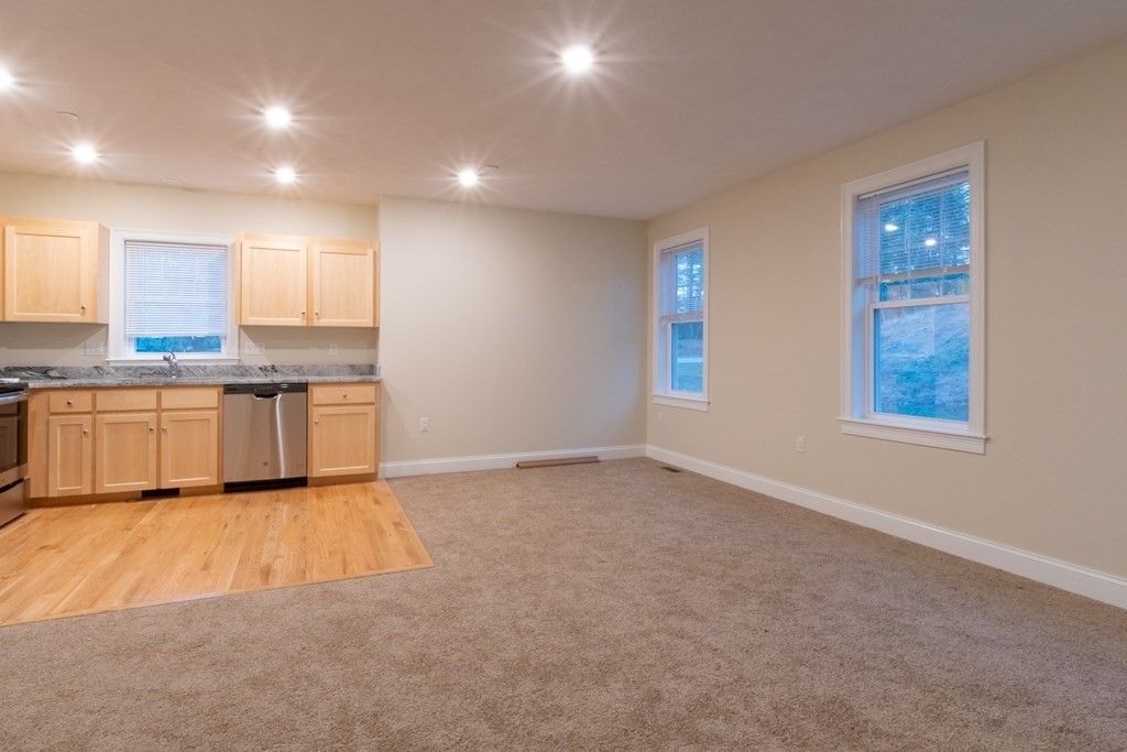 Empty room, Interior, Kitchen, Recessed Lighting, Stainless Steel Appliances, Wood Texture Flooring