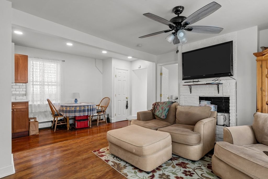 Dining room, Fireplace, Interior, Living room, Recessed Lighting, Wood Texture Flooring
