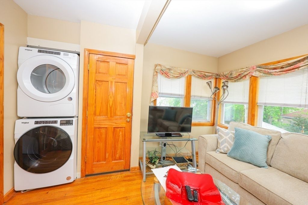 Interior, Living room, Utility Closets, Washer, Wood Texture Flooring