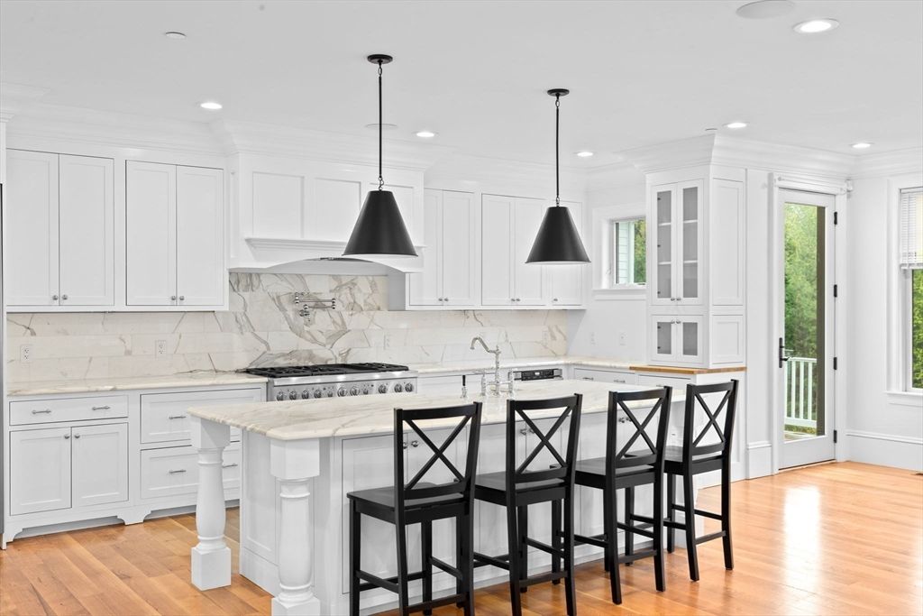 Interior, Kitchen, Marble Walls, Pendant Lights, Recessed Lighting, Stainless Steel Appliances, Wood Texture Flooring